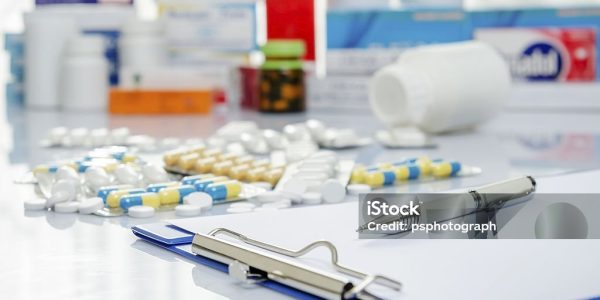 Lot of medicine pills and doctor note Lot of medicine pills and doctor note